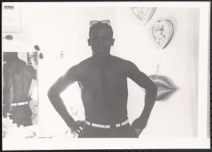 Young man posing in front of a mirror