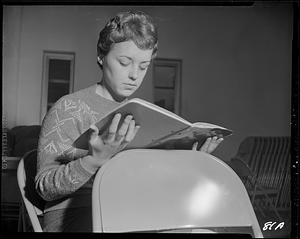 Woman reading manuscript