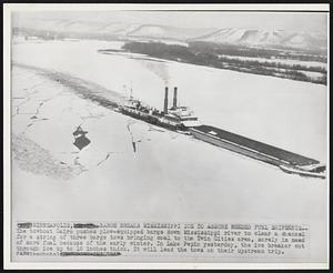 Minneapolis -- Barge Breaks Mississippi Ice to Assure Needed Fuel Shipments -- The towboat Cairo pushes plow-equipped barge down Mississippi river to clear a channel for a string of three barge tows bringing coal to the Twin Cities area, sorely in need of more fuel because of the early winter. In Lake Pepin yesterday, the ice breaker cut through ice up to 16 inches thick. It will lead the tows on their upstream trip.