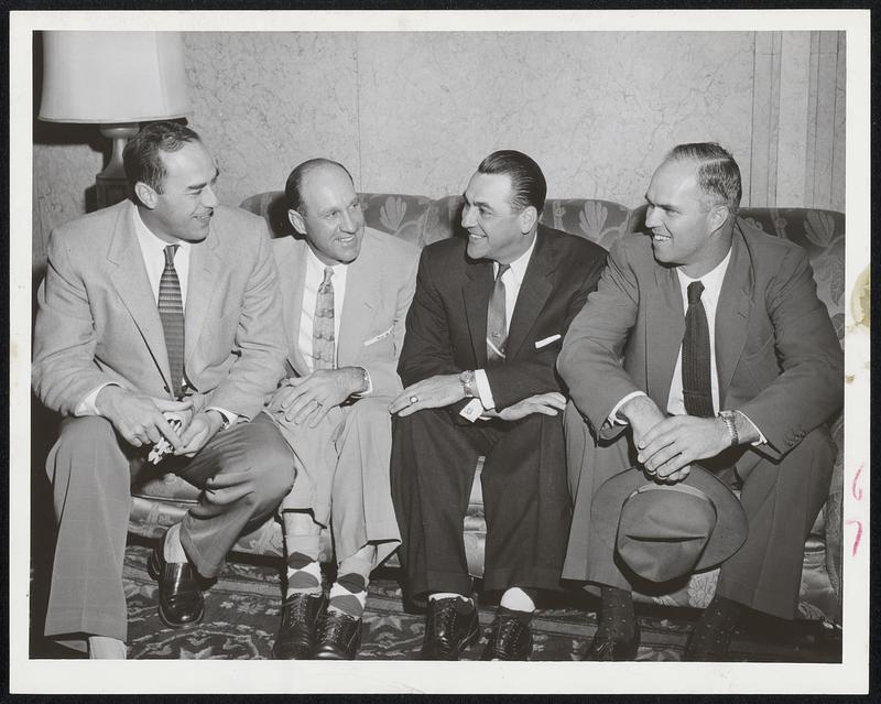 Former Yankees now with the Kansas City Athletics chat with Manager Lou Boudreau, third from left. The players, left to right, are Pitcher Vic Raschi, Outfielder Enos Slaughter and Pitcher John Sain, extreme right. The three originally were National Leaguers, Raschi and Slaughter with the Cardinals and Sain with the Boston Braves. The A’s were playing the Red Sox at Fenway Park today.