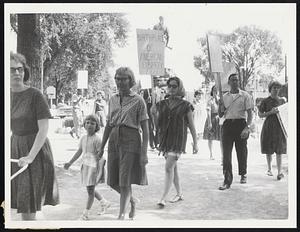 Controversy Raged between civil rights groups yesterday as CORE and NAACP representatives picketed Lexington Battle Green over alleged refusal of a home to a Negro. Local civil rights group denounced demonstration as unwarranted meddling.