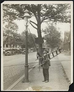 He Has Lighted 924,000 Gas Lamps, Sets 19,500-Mile Mark. Photo shows- Joseph Ciuffreda, 52 yrs. old has darkness into light for twent[y] years. Joe is the oldest lamplighter in Washington, he has lighted 924,000 lamps during his twenty-one years as a lamplighter and has walked more than 19,500 miles. Down the quiet streets he hastens, racing against darkness, pausing but a second at each lamp before hurrying on to the end of his pathway of light.