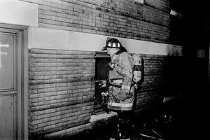 Capt Ed Doherty directing firefighter inside the basement