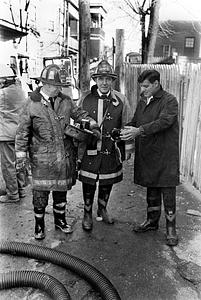 Fire Prevention firefighter John Kanarkiewicz, Lt. Pat Dunn, and State Fire Marshall O'Keefe collecting evidence