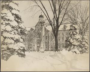Sacred Heart School building shown in snow, from the front