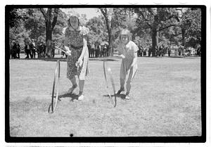 Girls rolling hoops