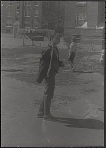 Young woman standing in Newtowne Court