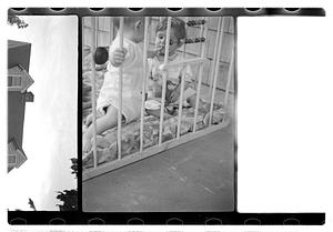 Two children in a playpen