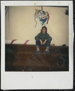 Boy sitting on steps