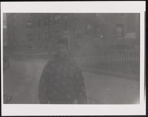 Girl in winter coat outside Newtowne Court