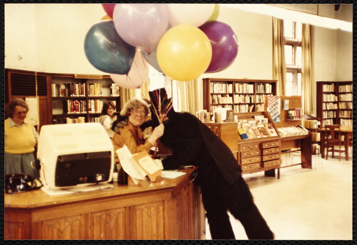Newton Free Library, Newton, MA. Staff & trustees. D. Seavey with balloons