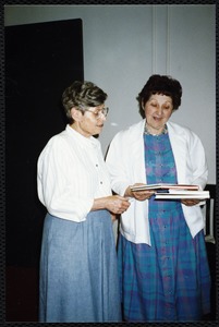Newton Free Library, Newton, MA. Communications & Programs Office. Virginia Tashjian with book. 1 woman