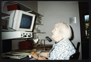 Newton Free Library, Newton, MA. Communications & Programs Office. Woman at reader, Social Services