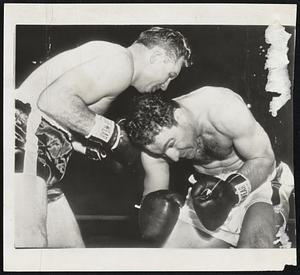 No Love in the City of Brotherly Love during last night's Philadelphia heavyweight bout between Rocky Marciano and Lee Savold, won by Brockton Rocky in the seventh on a TKO. On the left, both boxers duck, although neither is throwing a punch, while on the right, Marciano finds the range with a right uppercut to the head of a bloodied and battered Savold.
