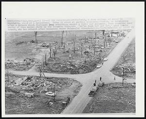 Pittsfield, Ohio - At The Crossroads - Pittsfield, a farm village of about 50 residents, stood at a crossroads. Today it stood at another crossroad-death, or rebuilding after a tornado which flattened everything except a Civil War monument, seen standing near center of this aerial photo by the Columbus Dispatch. "We're down but not out," said Harold Brandt, who has rebuilt after tornadoes twice before.