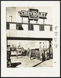 Another unit of combat troops of the Michigan national guard arrived in Flint, Mich., today and is shown taking position at Chevrolet plant No. 4 for duty in the strike area. The picture was telephoned to the Traveler.