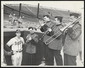 Serenades for Sain and how that boy deserves it. The Three Troubadours on the right plus one member of the band organized for the Series opener (standing with Sain) really put their hearts into "When Johnny Comes Marching Home" as he did with his four hit shutout over the Indians.