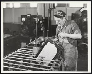 The Map Maker in a Changing World. The wax-engraved plate goed into an electrotype bath where a thin shell of copper is deposited by electrolysis, making a reverse image in relief of the engraved patch. Leo Sealy is examining the electrotype.