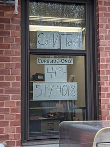 Curbside-only phone number signage