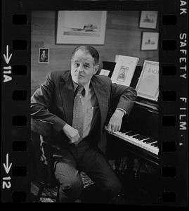 Dr. Robert Pearson seated at piano