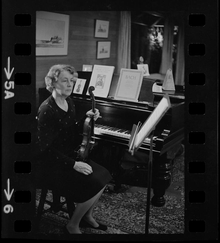 Florence Chapman Pearson seated with violin near piano