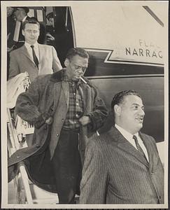 David Booker arrives at E.B. airport