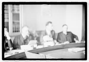 Group of men at table