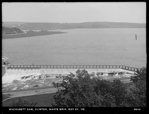 Wachusett Dam, Waste Weir, water flowing; man carrying camera on tripod in middle ground?; visit by MWSB board members and officials of cities and towns in the Metropolitan Water District (approximately 120 people attended), Clinton, Mass., May 27, 1908