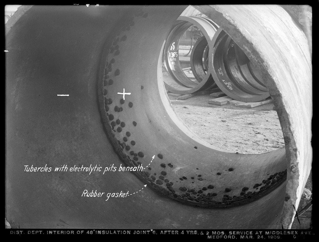 Distribution Department, Low Service Pipe Lines, interior of 48-inch insulation joint No. 6, after 4 years and 2 months service at Middlesex Avenue, showing tubercles with electrolytic pits beneath, Medford, Mass., Mar. 24, 1909