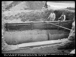 Distribution Department, Low Service Pipe Lines, 48-inch low service main laid in 1896; excavation for connection with new 48-inch main, Beacon Street at Harvard Street, Brookline, Mass., Apr. 6, 1909