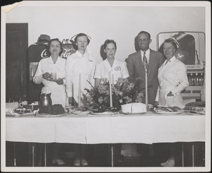 Staff at Veterans Administration Hospital behind banquet table