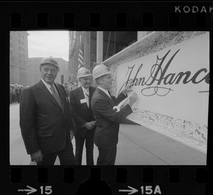 Gerhard Bleicken, Chairman, Frank Maher, President, both of John Hancock Mutual Insurance Company, and Mayor Kevin White signing the beam during the "topping off" ceremony for the new tower
