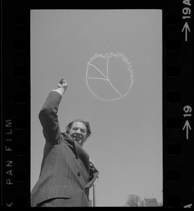 The handwriting is in the sky for Indiana Sen. Vance Hartke as he gives peace sign before attacking the Administration's Indochina war policy in a speech on the Boston Common yesterday