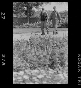 Two men walking along path on Hammersmith Farm, the Auchincloss estate in Newport, R.I.