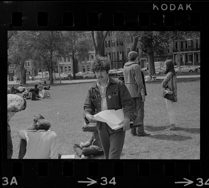 Hippie on the Boston Common passing out fliers