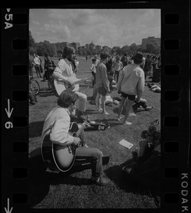 Hippies on the Boston Common playing guitar