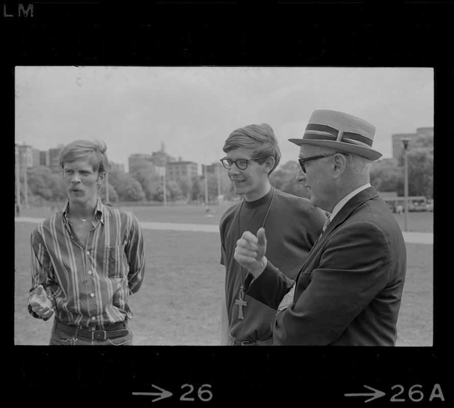 Man speaking to hippies on the Boston Common