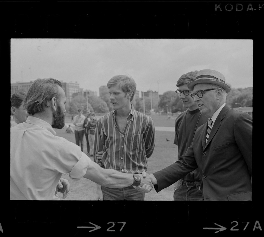 Man speaking to hippies on the Boston Common