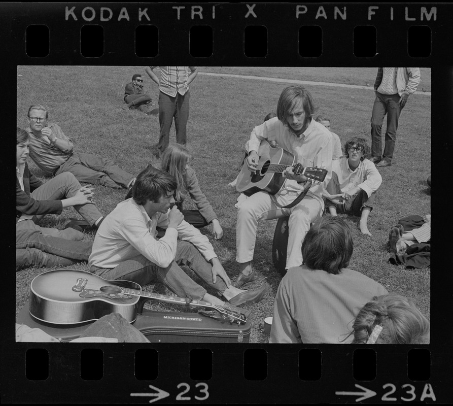 Hippies on the Boston Common playing guitar