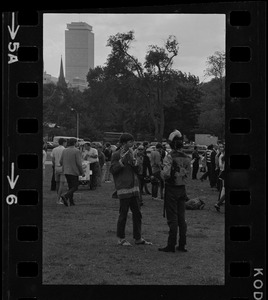 Hippies on the Boston Common, one plays a flute