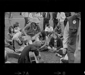 Hippies on the Boston Common playing guitar