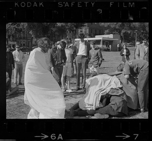 Hippies on the Boston Common, one wearing a toga