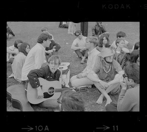 Hippies on the Boston Common playing guitar