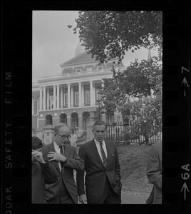 New MBTA Board Chair, Robert Wood, left, and Governor Sargent, right, walking in the Boston Common with the State House seen in the background