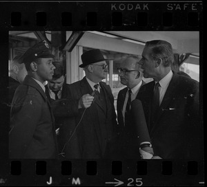 New MBTA Board Chair, Robert Wood, second from right, and Governor Sargent, far right, being interviewed while touring the MBTA