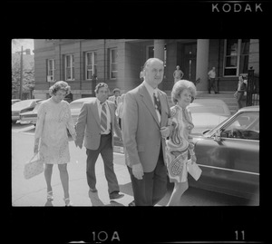 Outside Middlesex County Courthouse are Mrs. Florence Volpe and Arthur Volpe walking behind Woburn ex-Mayor Edward F. Gill and his wife