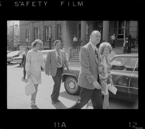 Outside Middlesex County Courthouse are Mrs. Florence Volpe and Arthur Volpe walking behind Woburn ex-Mayor Edward F. Gill and his wife