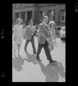 Outside Middlesex County Courthouse are Mrs. Florence Volpe and Arthur Volpe walking behind Woburn ex-Mayor Edward F. Gill and his wife