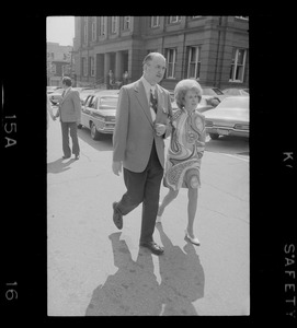 Woburn ex-Mayor Edward F. Gill and his wife seen outside Middlesex County Courthouse