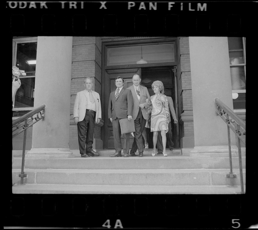 Charles J. DiPanfilo, Woburn ex-Mayor Edward F. Gill and his wife seen outside Middlesex County Courthouse